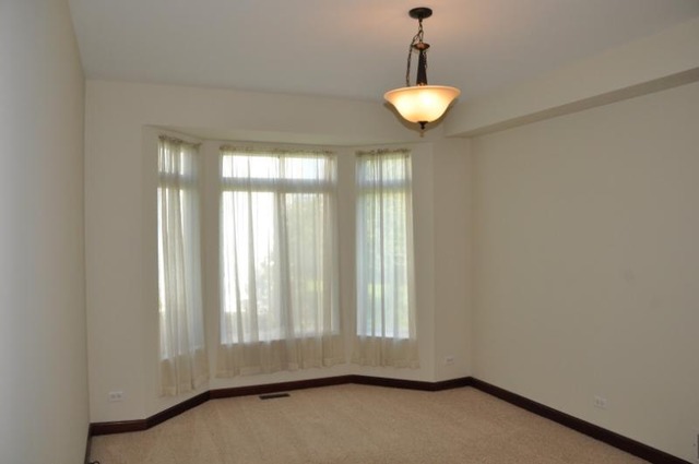 2205 Clipper Court Elgin, IL 60123 - Photo 7 of 24 a view of wooden floor and window in an empty room