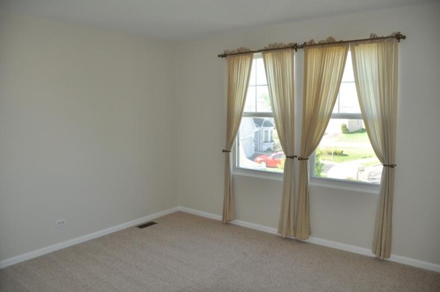 2205 Clipper Court Elgin, IL 60123 - Photo 9 of 24 an empty room with a window