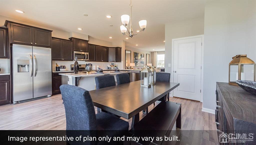 105 Matutina Road Iselin, NJ 08830 - Photo 4 of 20 a large kitchen with a table and chairs