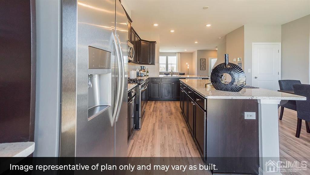105 Matutina Road Iselin, NJ 08830 - Photo 6 of 20 a kitchen with stainless steel appliances granite countertop a refrigerator a stove and a sink