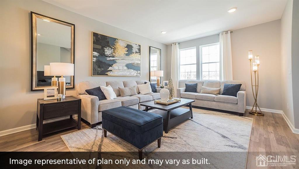 105 Matutina Road Iselin, NJ 08830 - Photo 8 of 20 a living room with furniture and a painting on the wall