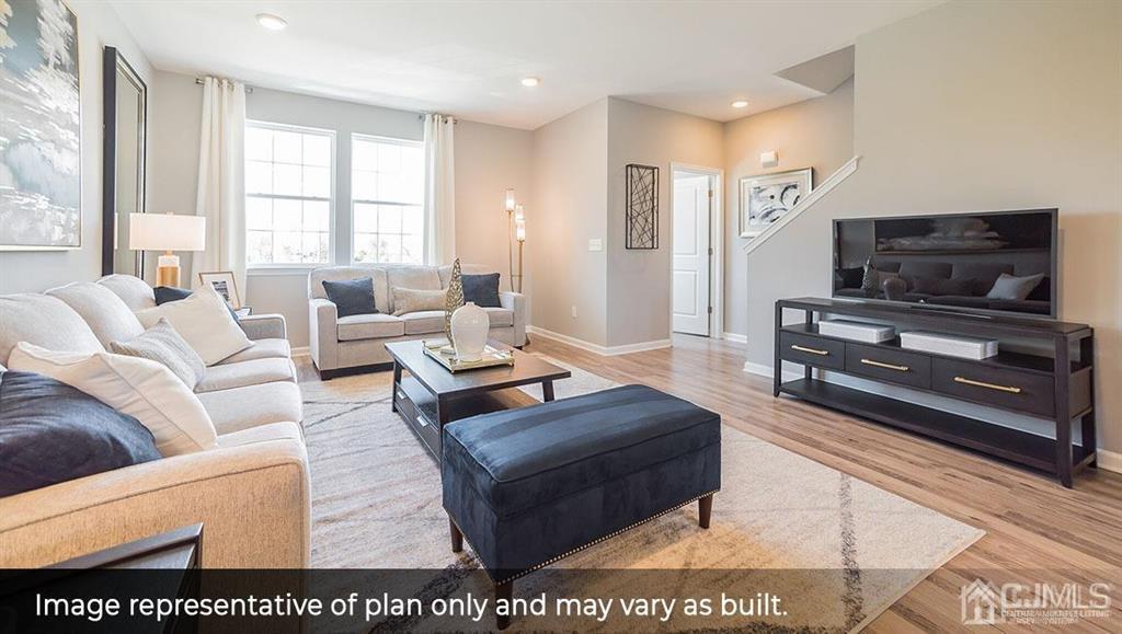 105 Matutina Road Iselin, NJ 08830 - Photo 9 of 20 a living room with furniture and a flat screen tv