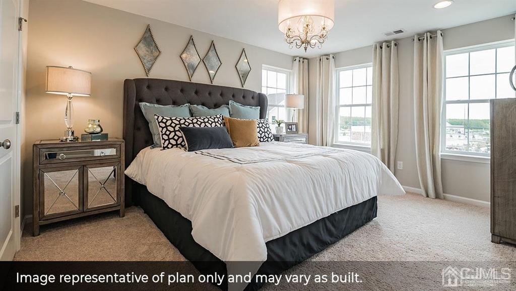 105 Matutina Road Iselin, NJ 08830 - Photo 10 of 20 a bed sitting in a bedroom next to a window