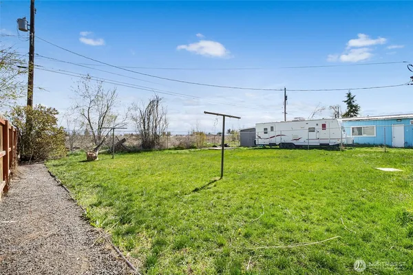 a view of a house with a backyard