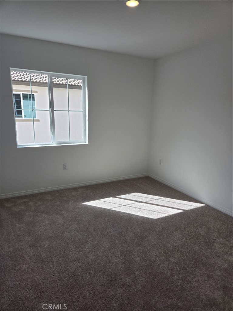 7281 Olive Grv Street Riverside, CA 92507 - Photo 13 of 27 a view of empty room with window