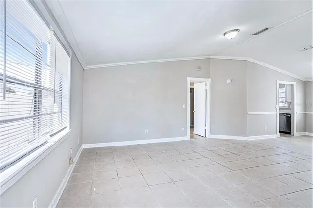 a view of an empty room with a window