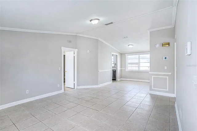 a view of an empty room and window