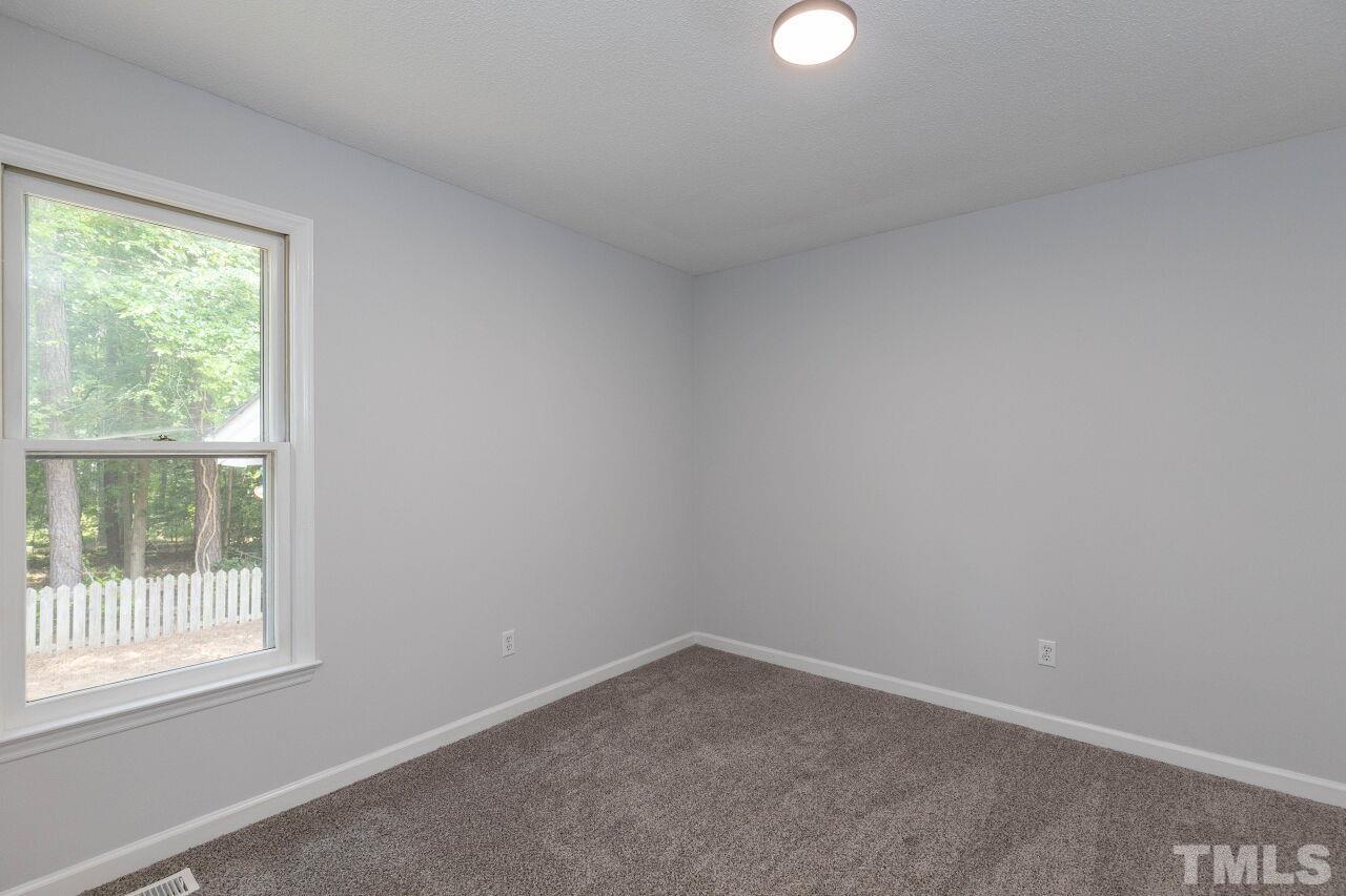 3504 Castlegate Drive Raleigh, NC 27616 - Photo 23 of 30 a room that has a window in it