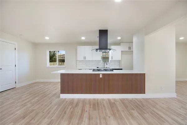 a view of kitchen with wooden floor