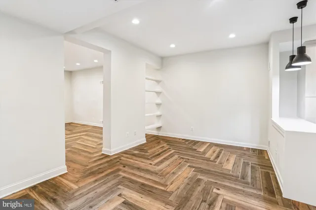 a view of room with wooden floor and window