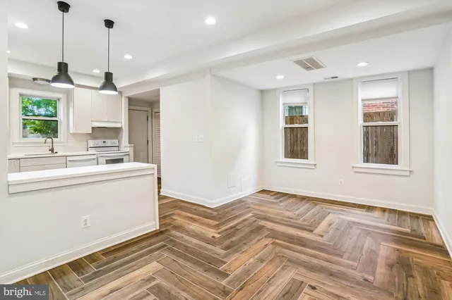 a kitchen with sink and window