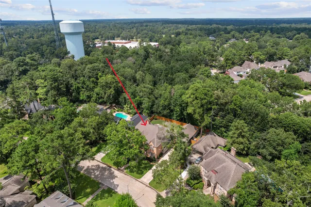a view of swimming pool with a back yard