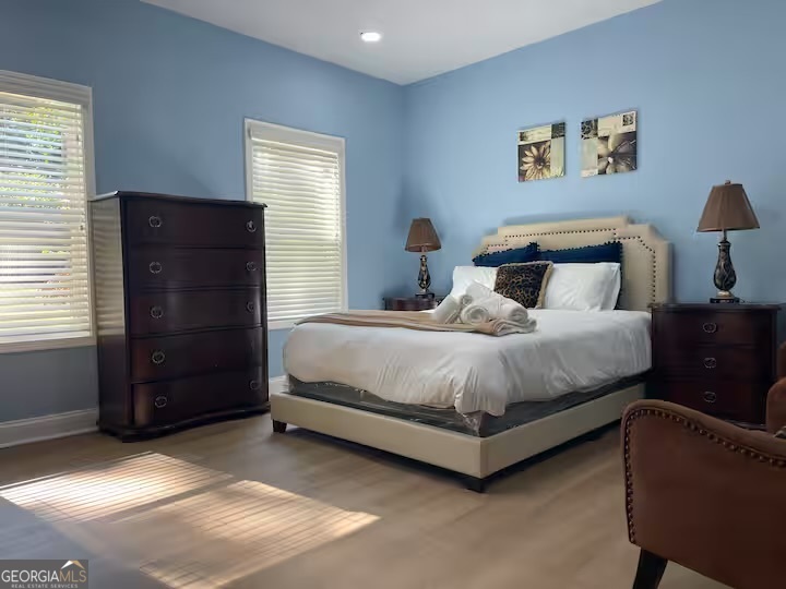 1230 Woodland Avenue Southeast Atlanta, GA 30316 - Photo 13 of 17 a bedroom with a bed and a dresser