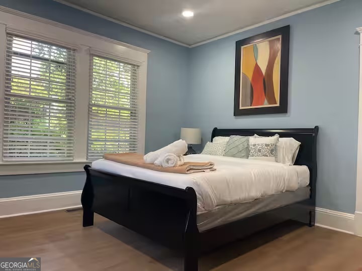 1230 Woodland Avenue Southeast Atlanta, GA 30316 - Photo 14 of 17 a bedroom with a bed and a window