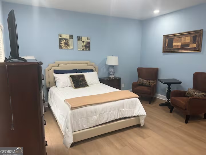 1230 Woodland Avenue Southeast Atlanta, GA 30316 - Photo 16 of 17 a bedroom with bed and a flat screen tv