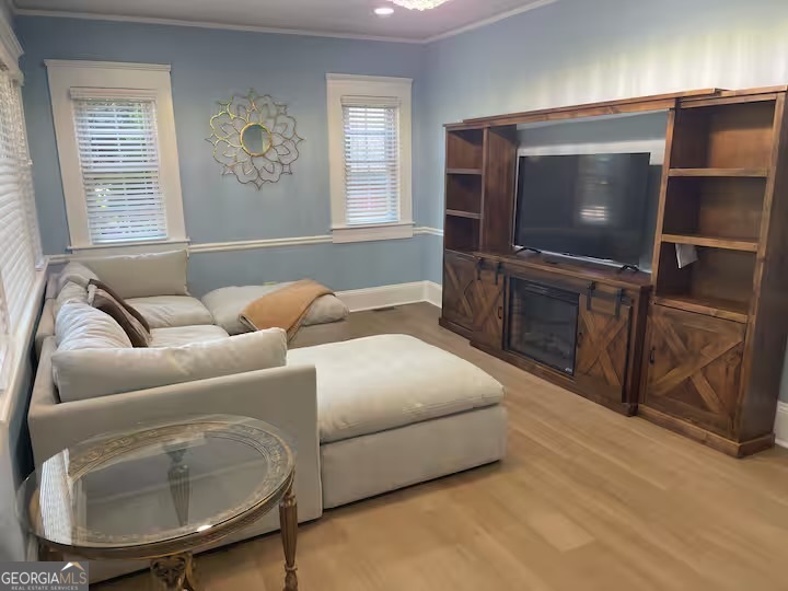 1230 Woodland Avenue Southeast Atlanta, GA 30316 - Photo 4 of 17 a living room with furniture and a flat screen tv