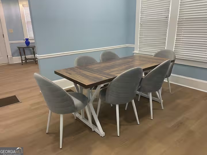1230 Woodland Avenue Southeast Atlanta, GA 30316 - Photo 6 of 17 a dining room with furniture and wooden floor