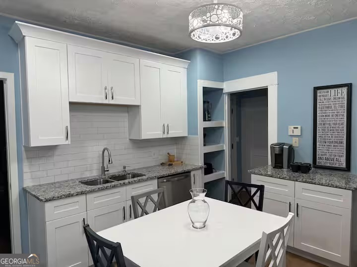 1230 Woodland Avenue Southeast Atlanta, GA 30316 - Photo 8 of 17 a kitchen with a sink a stove and cabinets
