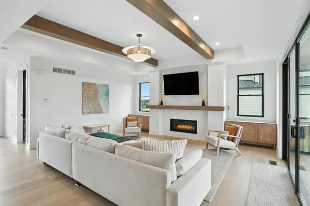 a large kitchen with a table and chairs