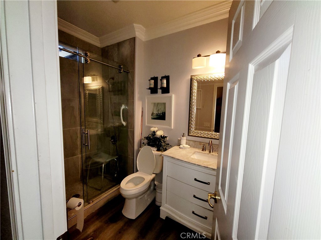 14119 Ashton Lane Riverside, CA 92508 - Photo 19 of 47 a bathroom with a sink toilet and shower