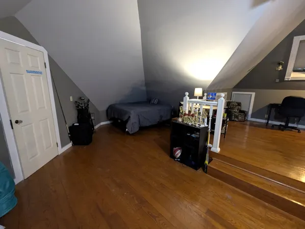 a room with furniture and a wooden floor