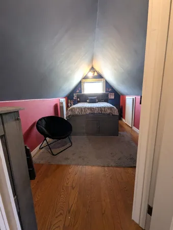 a view of lobby with a chair and mirror