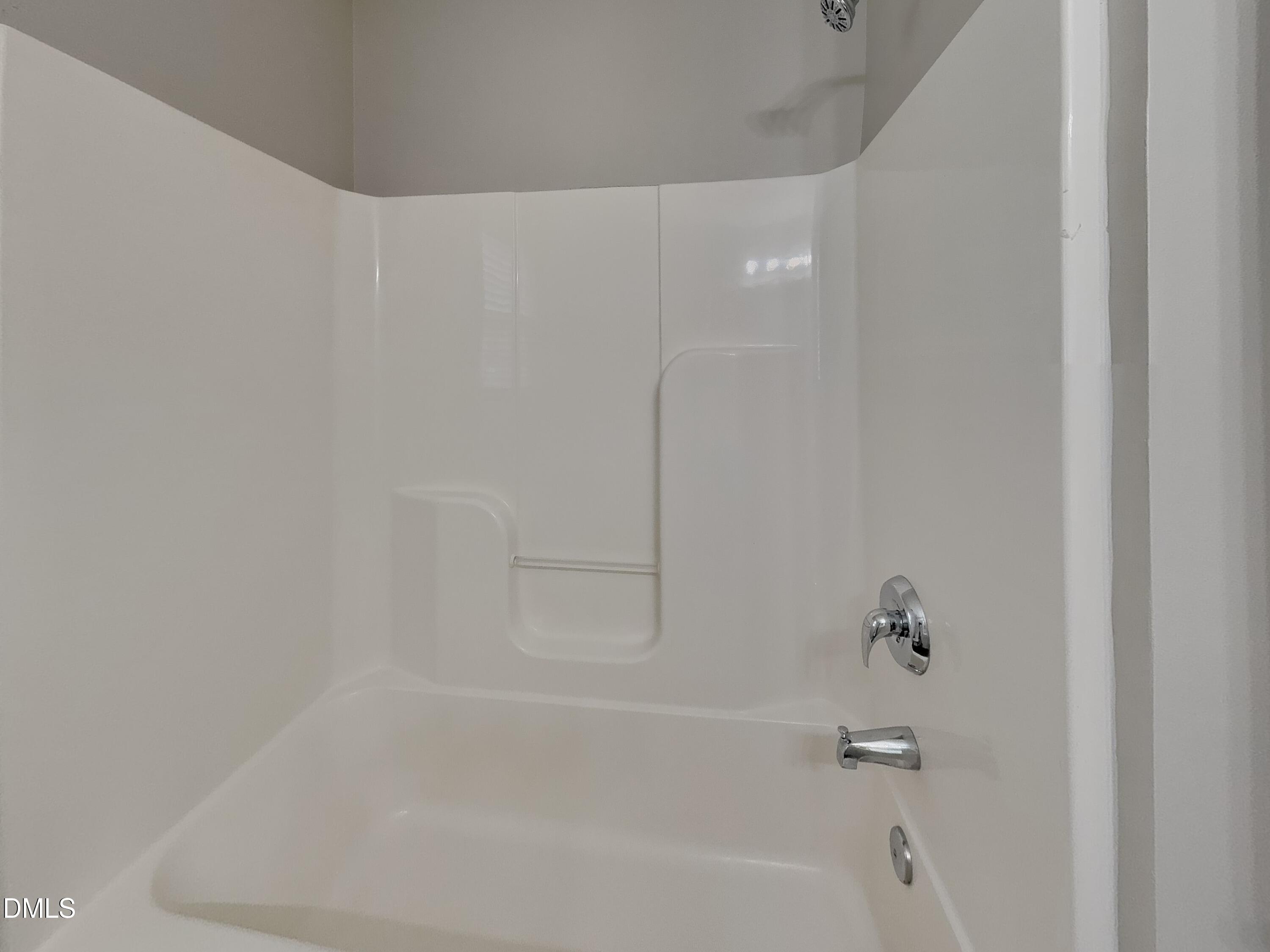 5816 Wynmore Road Raleigh, NC 27610 - Photo 15 of 18 a close up of a bathtub