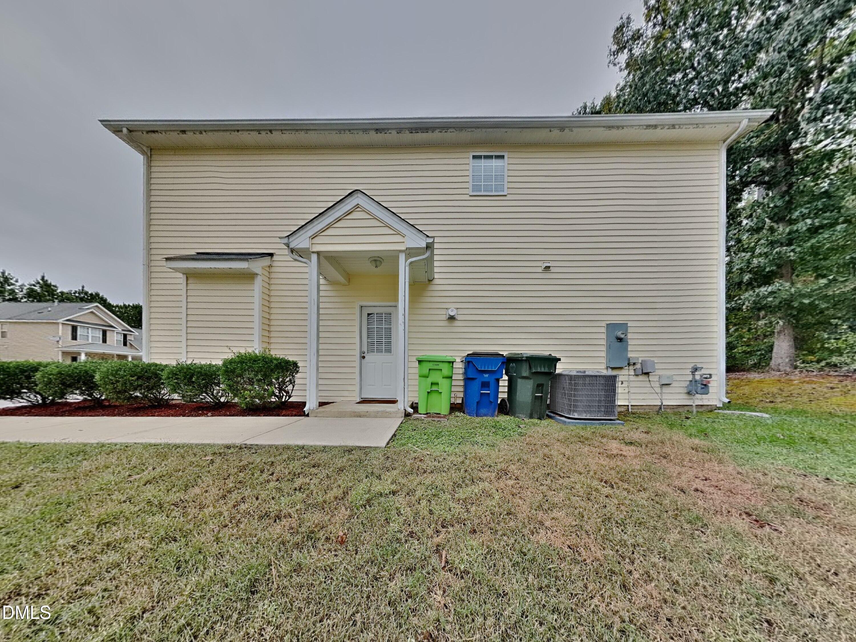 5816 Wynmore Road Raleigh, NC 27610 - Photo 18 of 18 a front view of house with yard and green space