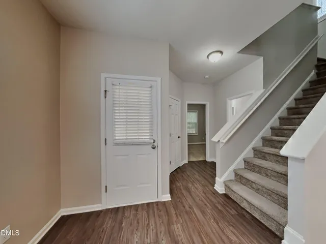 a view of entryway with wooden floor