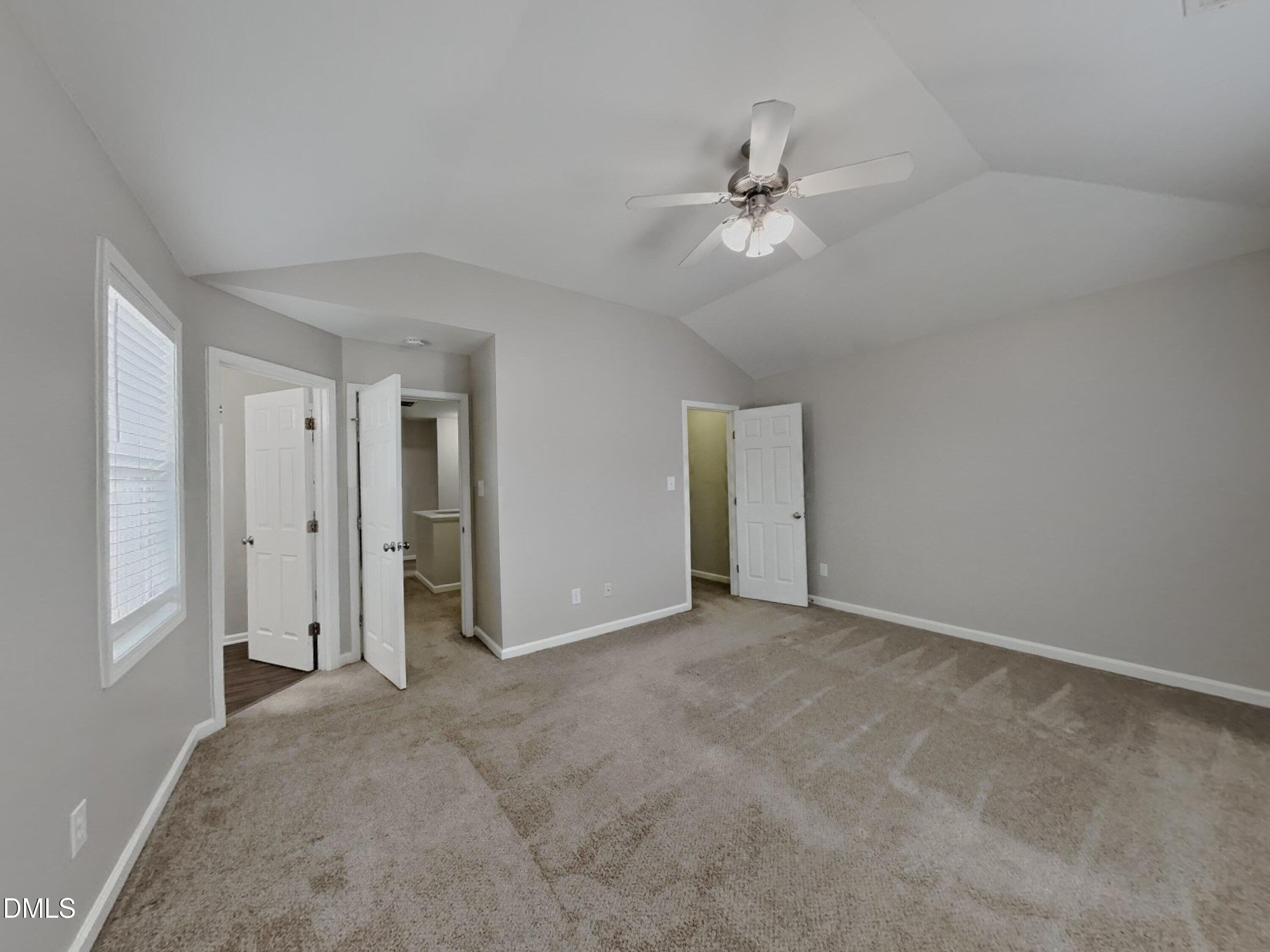 5816 Wynmore Road Raleigh, NC 27610 - Photo 7 of 18 a view of an empty room with a window