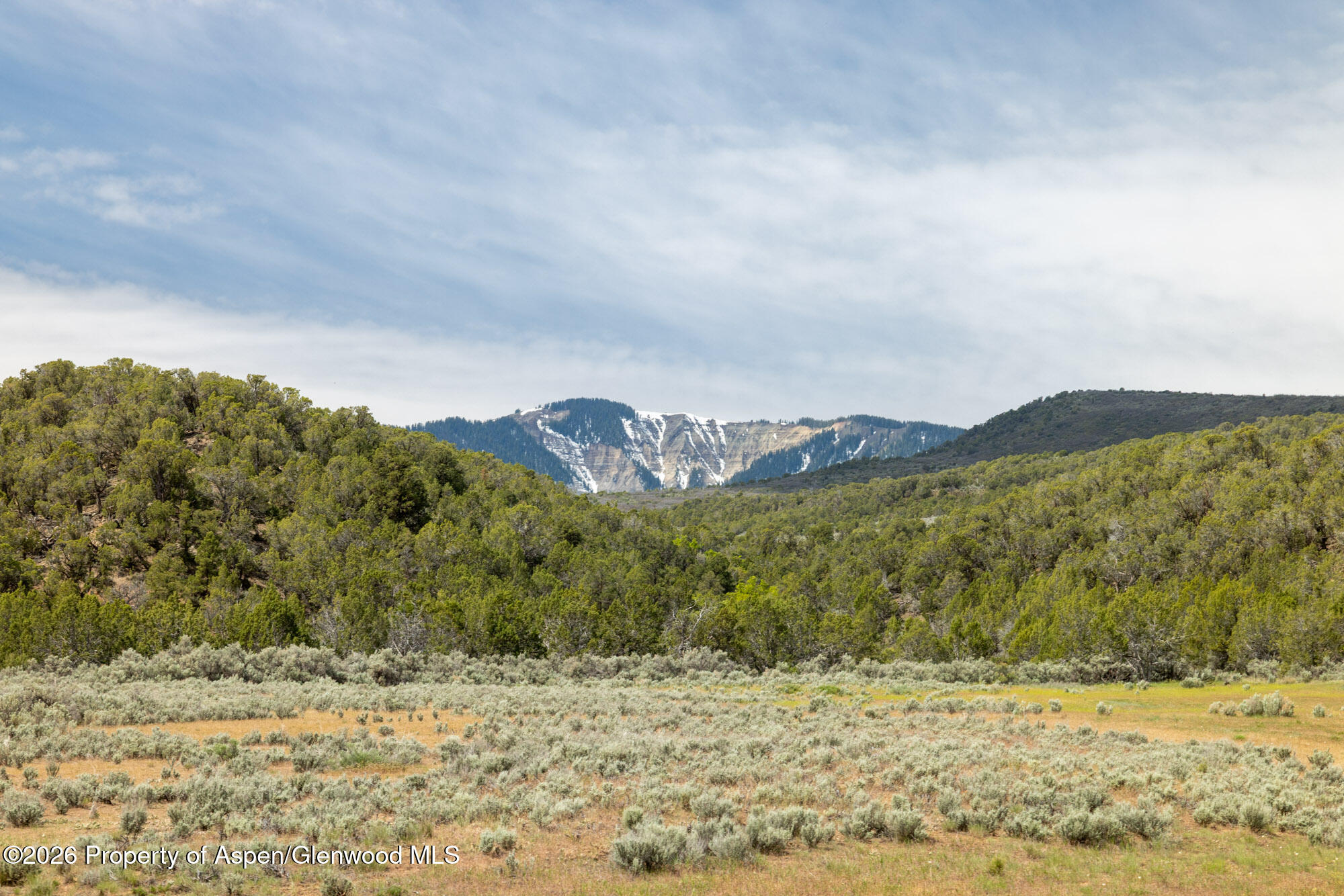 Tbd North Cedar Springs Ranch Road Rifle, CO 81650 - Photo 1 of 13 a view of a lake with a mountain in the background