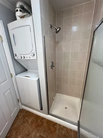 a bathroom with a shower and toilet