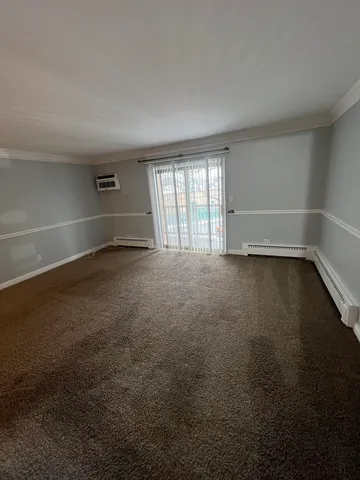 an empty room with a empty space and a window