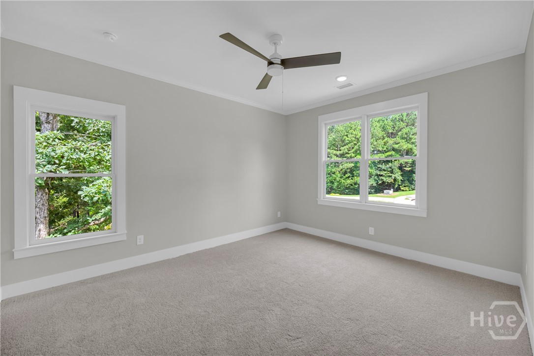 2476 St Martin Way Monroe, GA 30656 - Photo 57 of 75 Spacious room featuring light gray walls, plush gray carpeting, and white trim