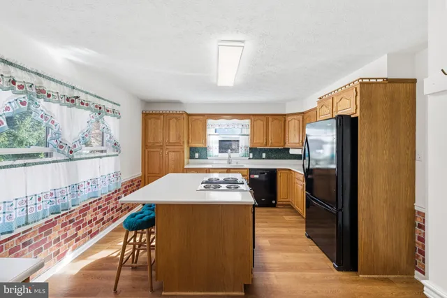 a kitchen with a sink and a window