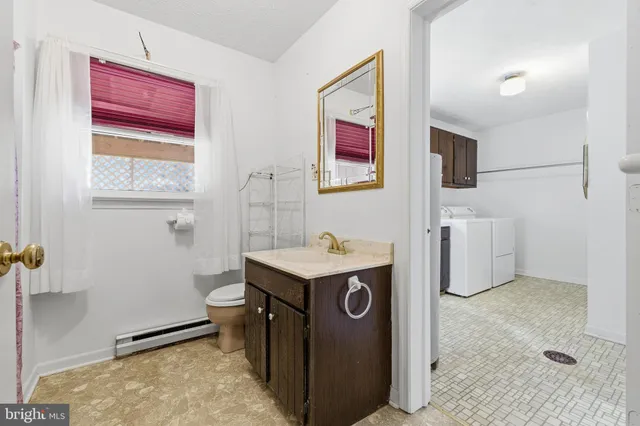 a view of a house with wooden fence