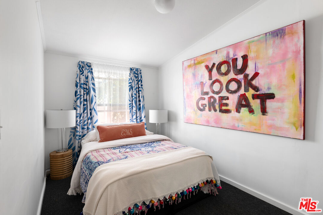 29500 Heathercliff Road, Unit 53 Malibu, CA 90265 - Photo 16 of 24 a bedroom with a bed and a window