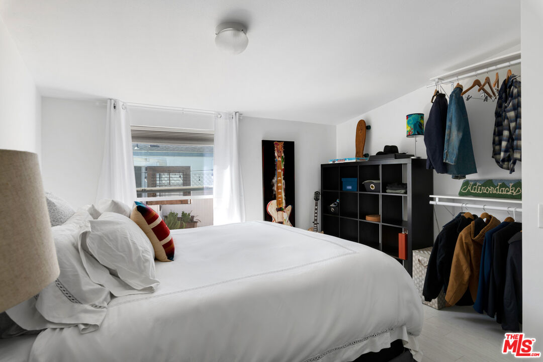 29500 Heathercliff Road, Unit 53 Malibu, CA 90265 - Photo 17 of 24 a bedroom with a bed and a television