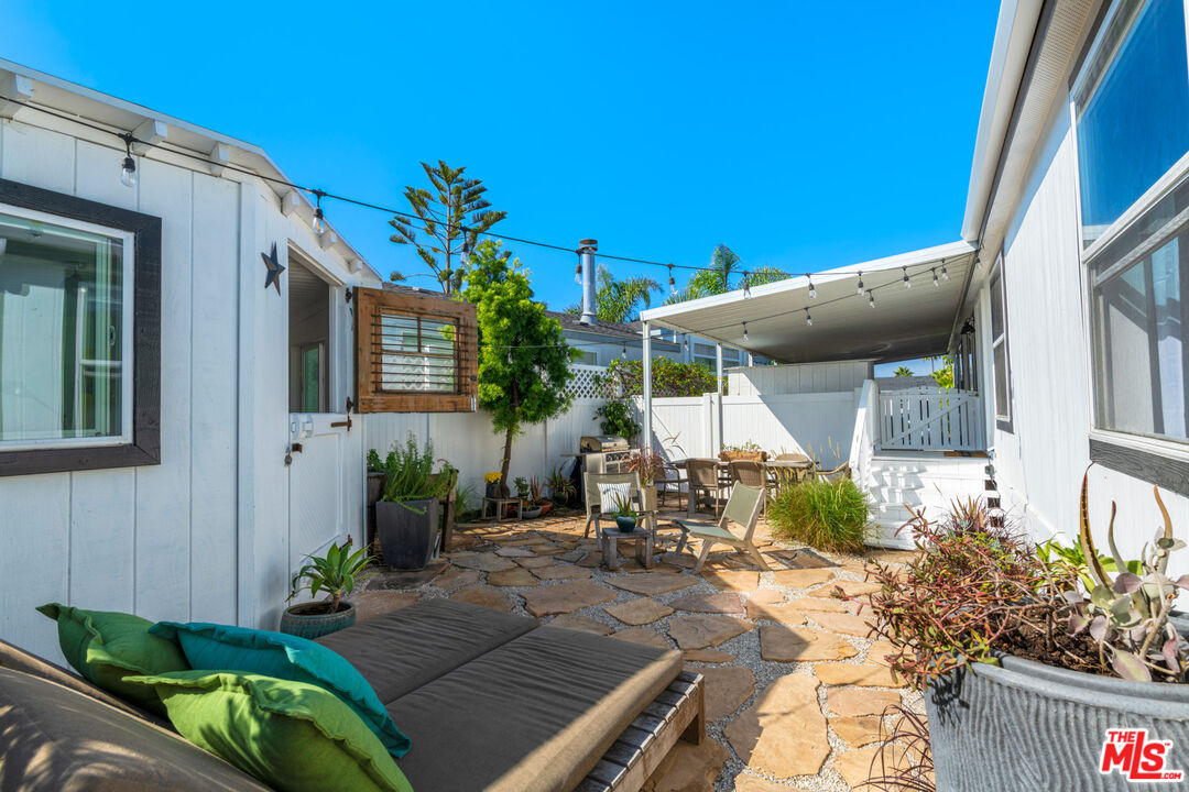 29500 Heathercliff Road, Unit 53 Malibu, CA 90265 - Photo 3 of 24 a view of a house with backyard and sitting area