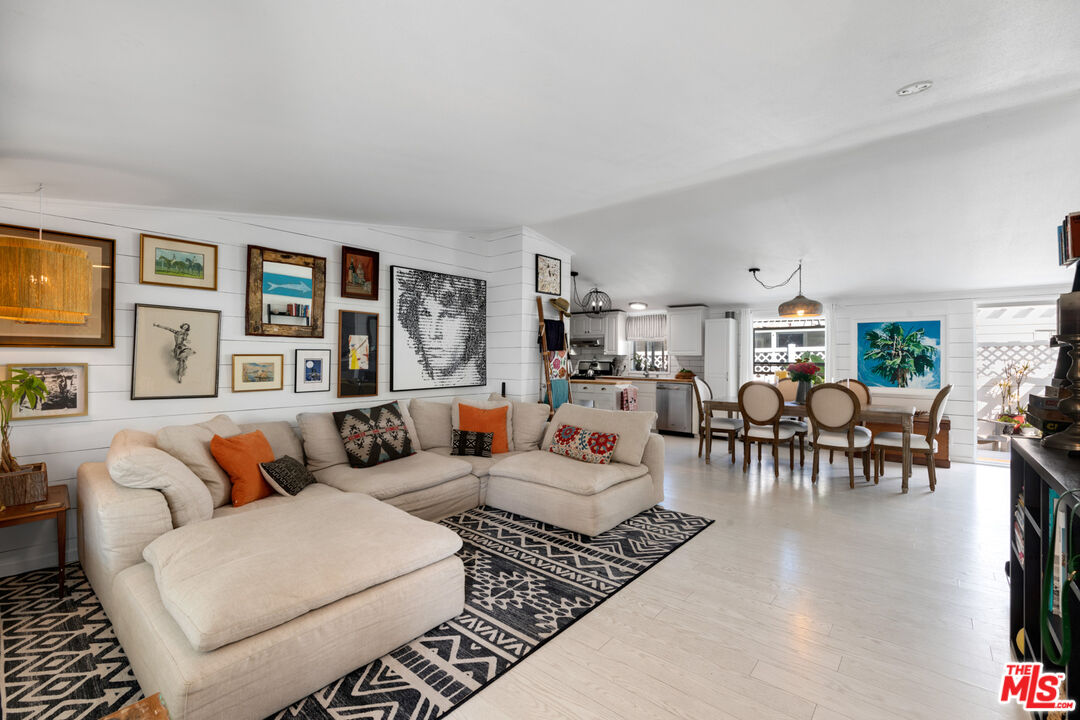 29500 Heathercliff Road, Unit 53 Malibu, CA 90265 - Photo 5 of 24 a living room with furniture and a large window