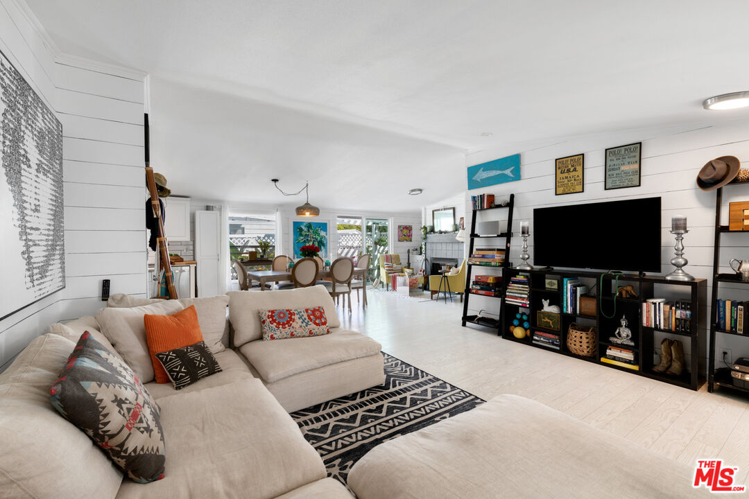 29500 Heathercliff Road, Unit 53 Malibu, CA 90265 - Photo 6 of 24 a living room with furniture and a flat screen tv