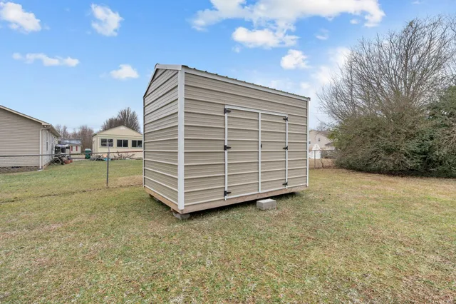 a backyard of a house with lots of green space