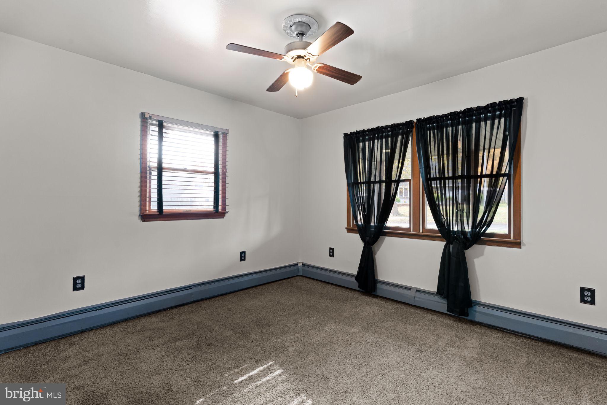 212 Plumbridge Drive Levittown, PA 19056 - Photo 12 of 19 a view of room with window and ceiling fan
