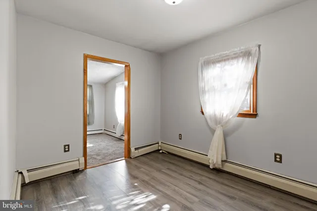 a view of room with window and ceiling fan