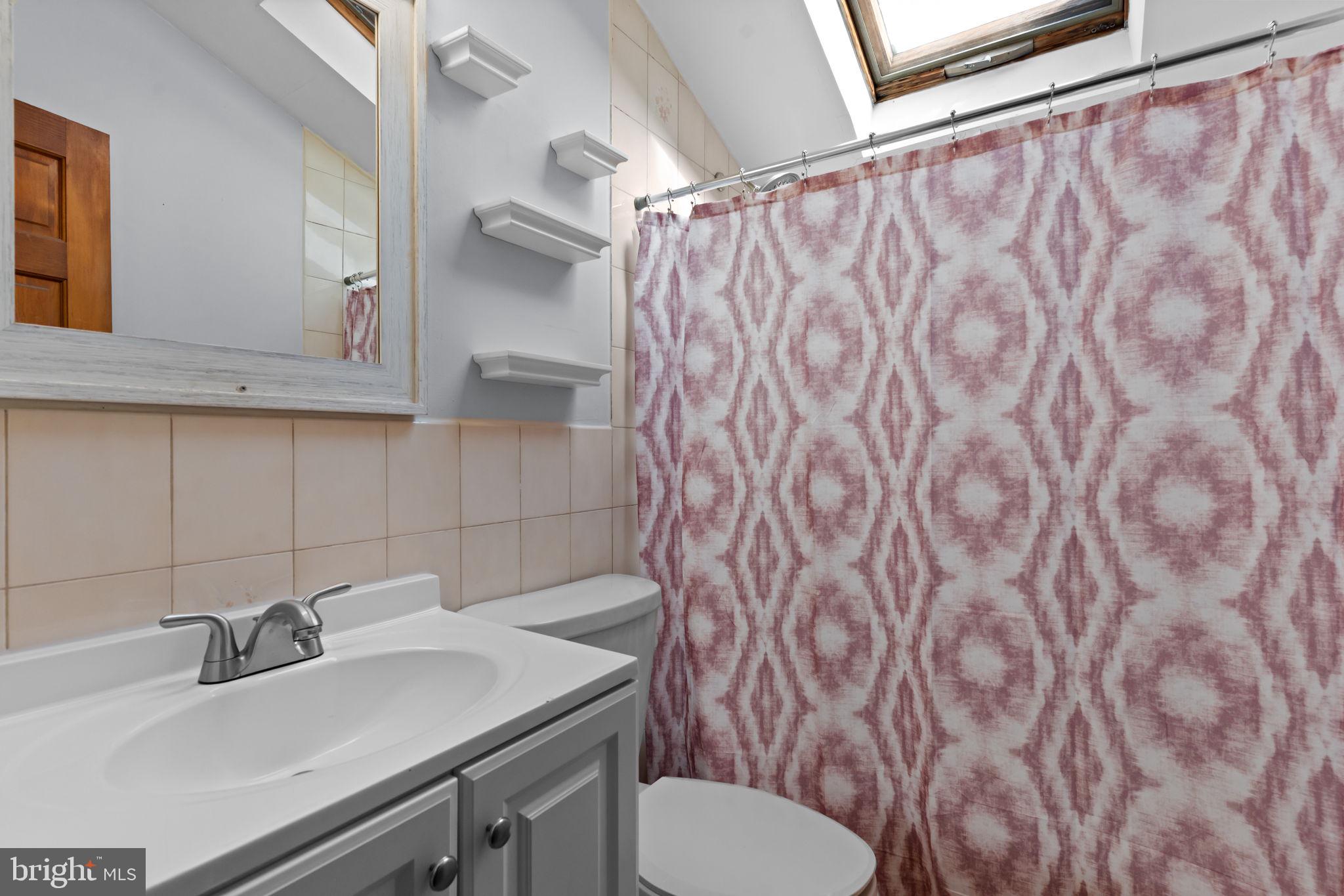 212 Plumbridge Drive Levittown, PA 19056 - Photo 15 of 19 a bathroom with a sink and a toilet