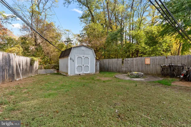 a view of a backyard with swimming pool