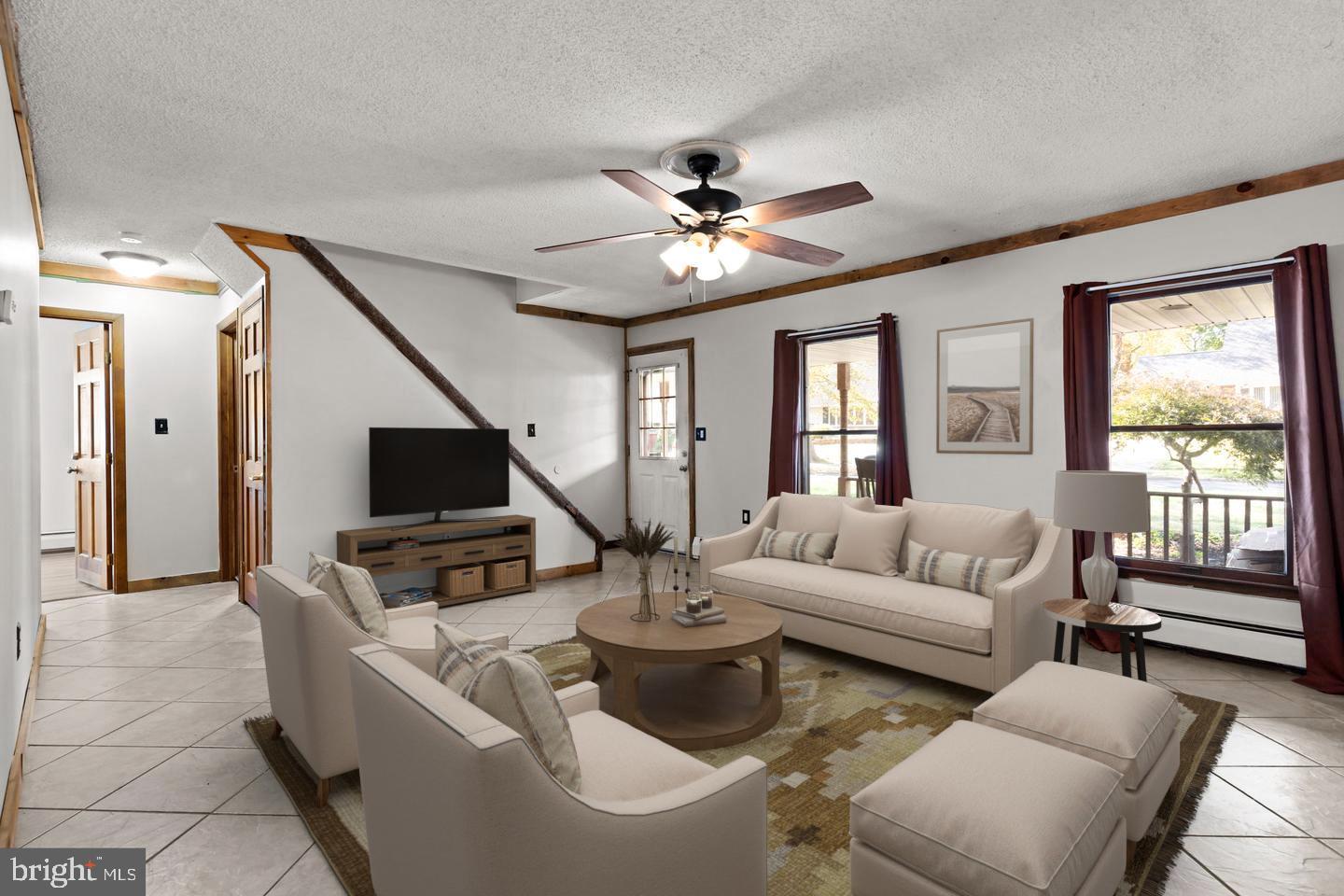 212 Plumbridge Drive Levittown, PA 19056 - Photo 3 of 19 a living room with furniture and a flat screen tv