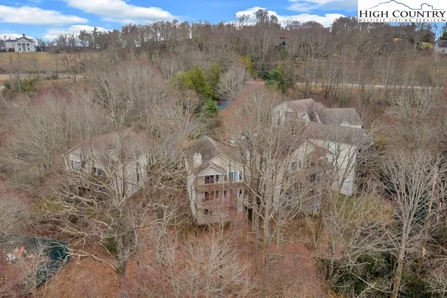 a view of a town with mountains in the background