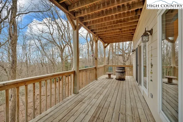 a view of a balcony with wooden floor