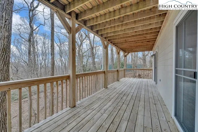a view of balcony with wooden floor